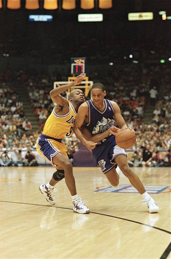 Los Angeles Lakers Nick Van Exel, left, reaches in as Utah Jazz Howard Eisley drives to the basket during the first half of Game 4 of the Western Conference finals on Sunday, May 24, 1998 in Inglewood, California. (AP Photo/Mark J. Terrill)