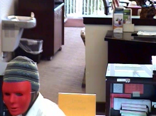 Police investigate whether same masked man robbed 2 banks