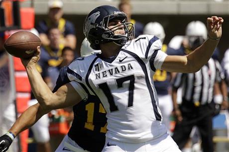 FILE - In this Sept. 1, 2012, file photo, Nevada quarterback Cody Fajardo (17) drops back to pass against California during the first half of an NCAA college football game in Berkeley, Calif. (AP Photo/Ben Margot, File)