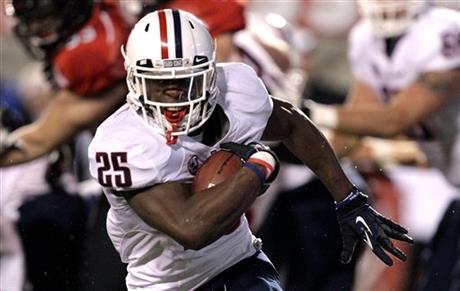 Arizona running back Ka'Deem Carey (25) carries the ball during the first quarter of an NCAA college football against Utah, Saturday, Nov. 17, 2012, in Salt Lake City. (AP Photo/Rick Bowmer)