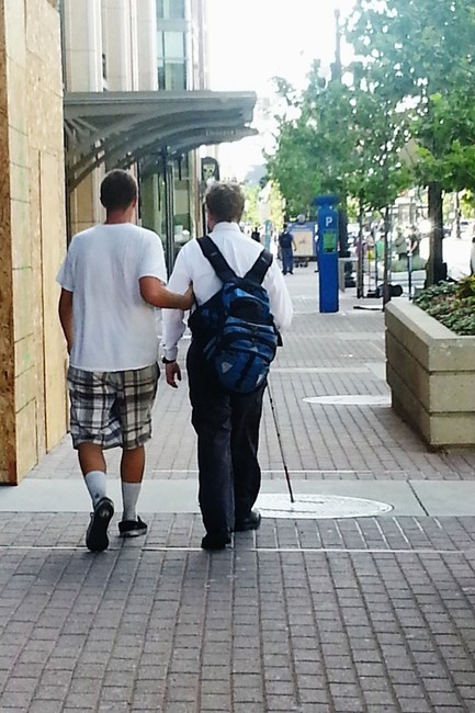 Panhandler saves blind man from danger