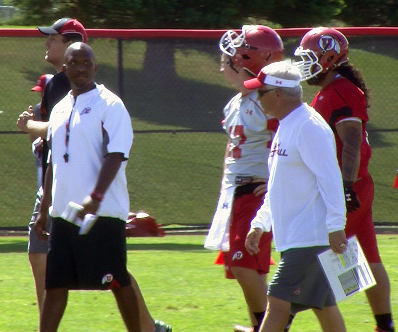 Utah co-offensive coordinators Brian Johnson 
(left) and Dennis Erickson during day 2 of fall 
camp (Photo: Robert Jackson)