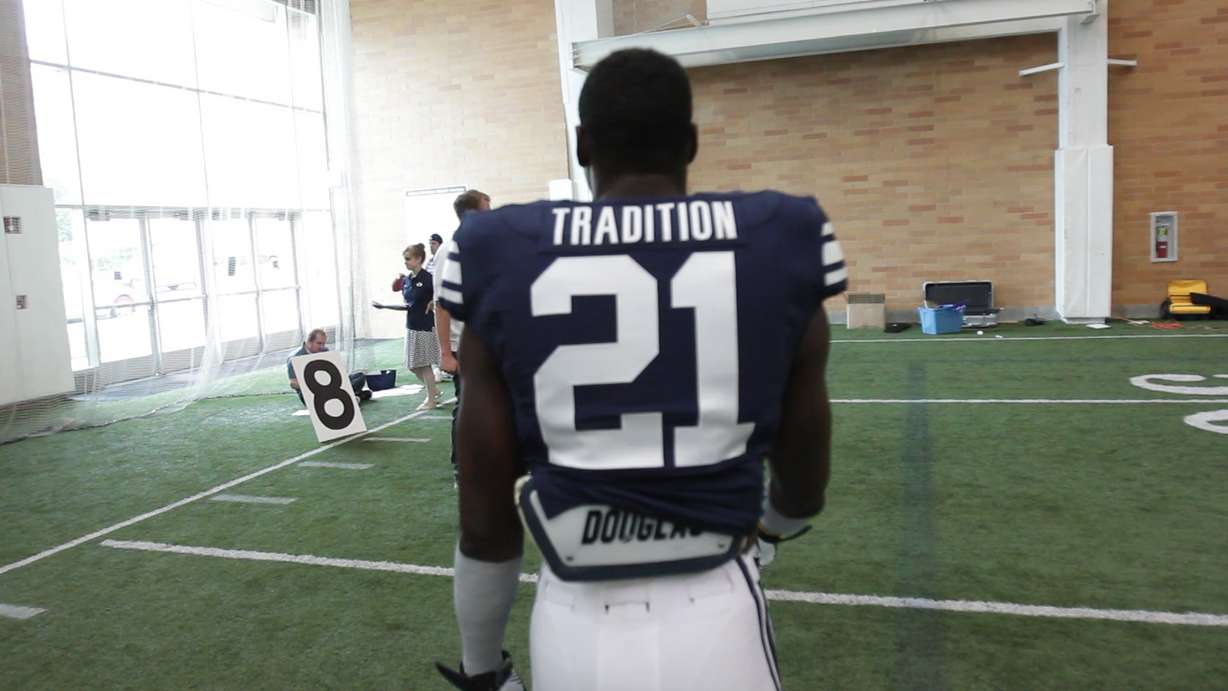 BYU head coach Bronco Mendenhall wanted his team to wear spirit,
tradition or honor on the back of their jerseys.