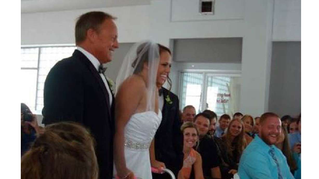 Paralyzed bride fulfills promise to self to walk down aisle
