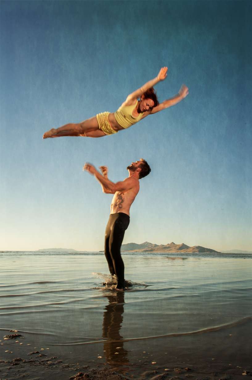 Yogis practicing AcroYoga moves