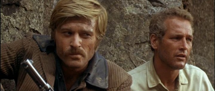 The Sundance Kid is trying to figure out why Butch's name is first while 
Butch wonders if his bike will get stolen because he didn't lock it up.