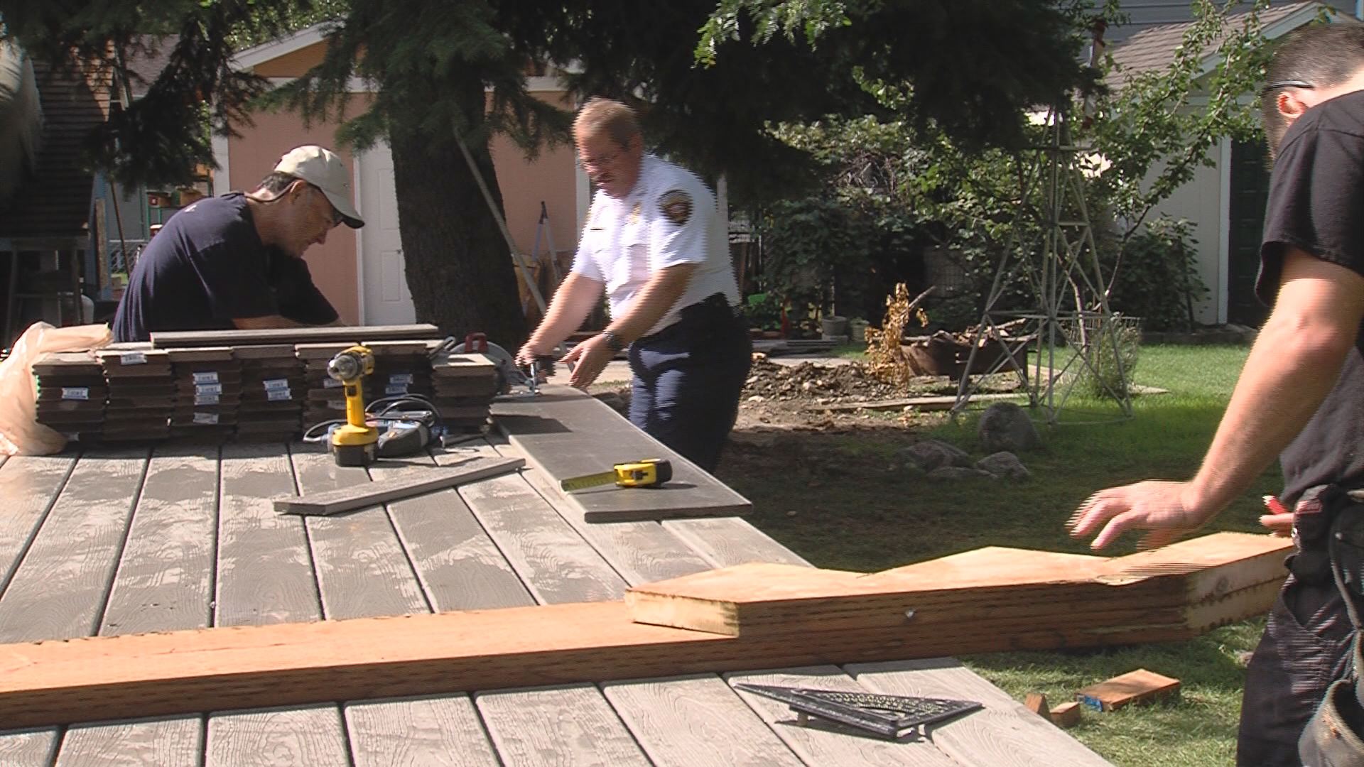 Firefighters build deck for coworker with cancer