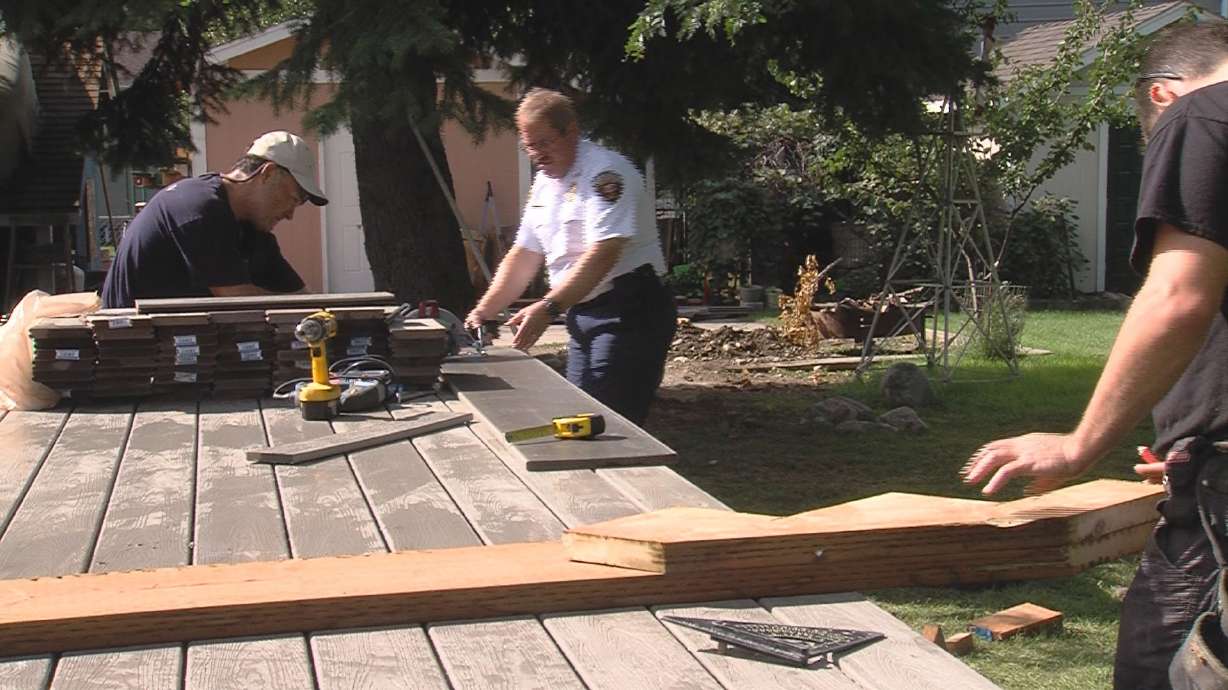 Firefighters build deck for coworker with cancer