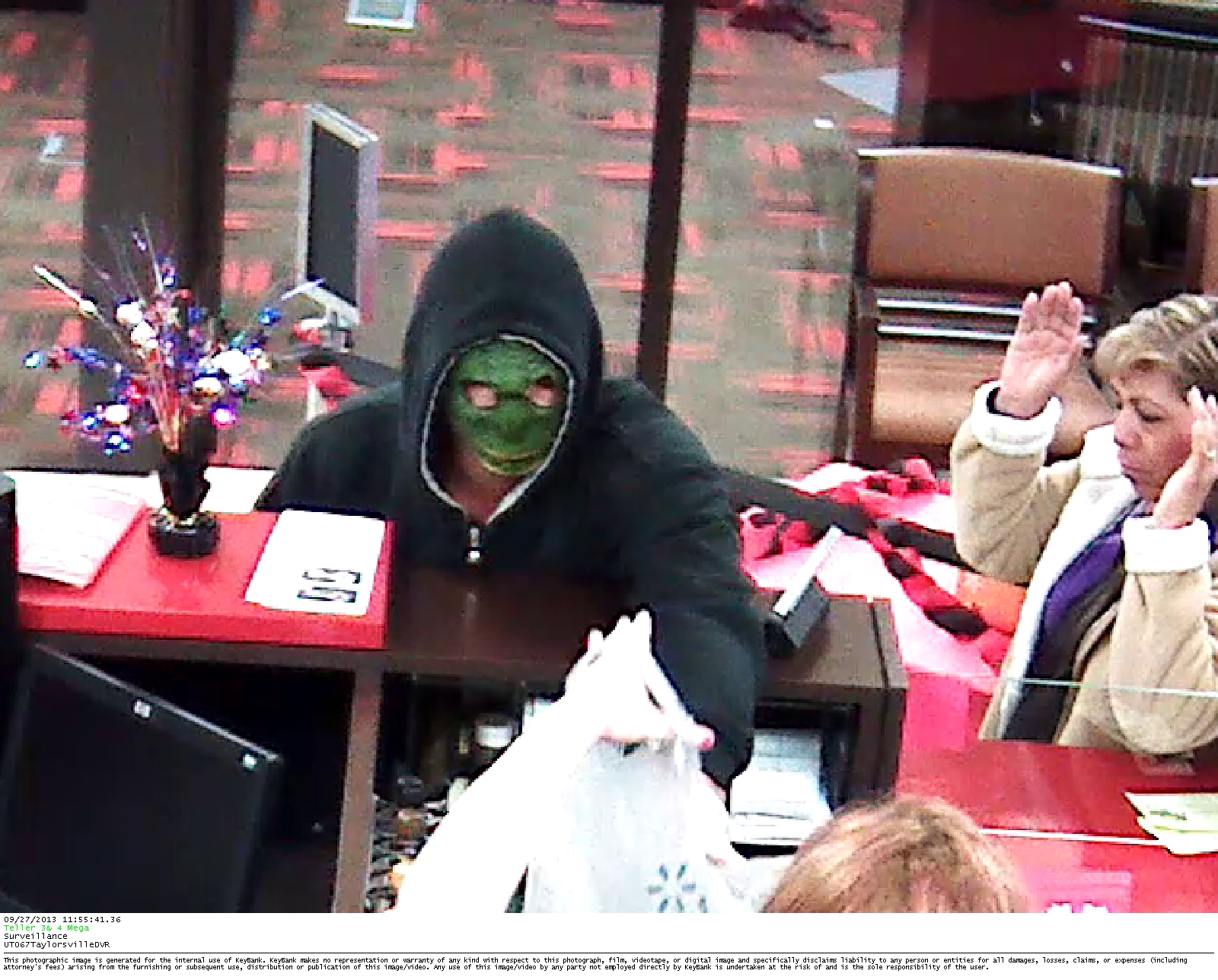 Man robs Key Bank wearing green mask