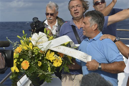 Migrant coffins lined up in Italian airport hangar