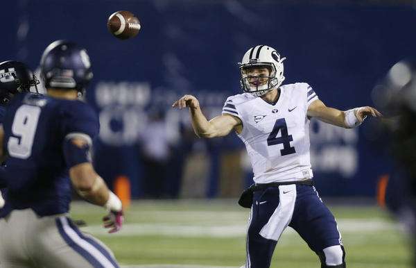 Brigham Young Cougars quarterback Taysom Hill (4) flips a pass
against USU during NCAA football game in Logan Friday, Oct. 4, 2013.
BYU won 31-14. (Jeffrey D. Allred, Deseret News)