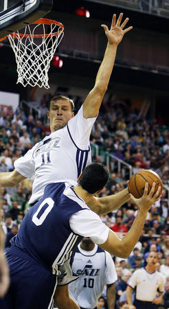 Andris Biedrins reaches to block Enes Kanter as the Utah Jazz scrimmage in Salt Lake City, Saturday, Oct. 5, 2013. (Ravell Call, Deseret News)