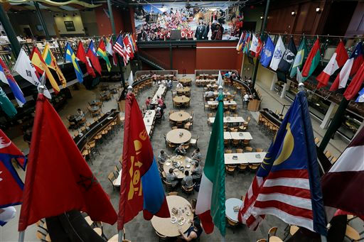In this Oct. 1, 2013, photo, students gather in the Trojan Dining Hall on the campus of Troy University in Troy, Ala. Tucked in rural southeast Alabama, Troy University has opened something that's a rarity for a public college in the United States: A faith-based dorm community where daily Bible studies are common and beer drinking is strictly forbidden. (AP Photo/Dave Martin)