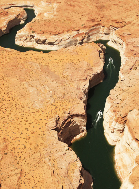 Boaters travel in a canyon near Dangling Rope Marina on Lake Powell Friday, June 21, 2013. The national recreation area, which was closed by the Oct. 1 federal government shutdown, will reopen Saturday thanks to a deal struck between Gov. Gary Herbert and the U.S Department of the Interior. (Photo: Jeffrey D. Allred, Deseret News)