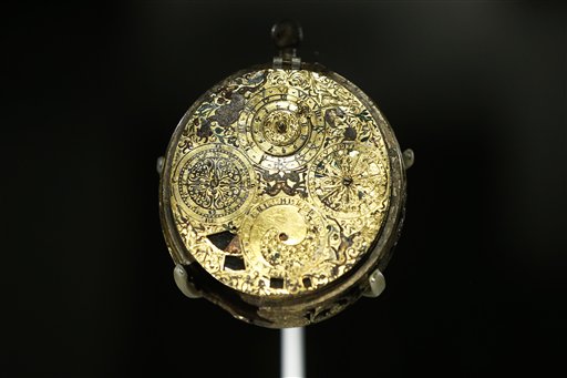 In this Monday, Oct. 7, 2013 photo, a gilt-
brass and enamel clock-watch with alarm and
calendar made by Gaultier Ferlite is seen on
display in an exhibition 'The Cheapside Hoard:
London's Lost Jewels' at the Museum of London
in the City of London. (AP Photo/Sang Tan)