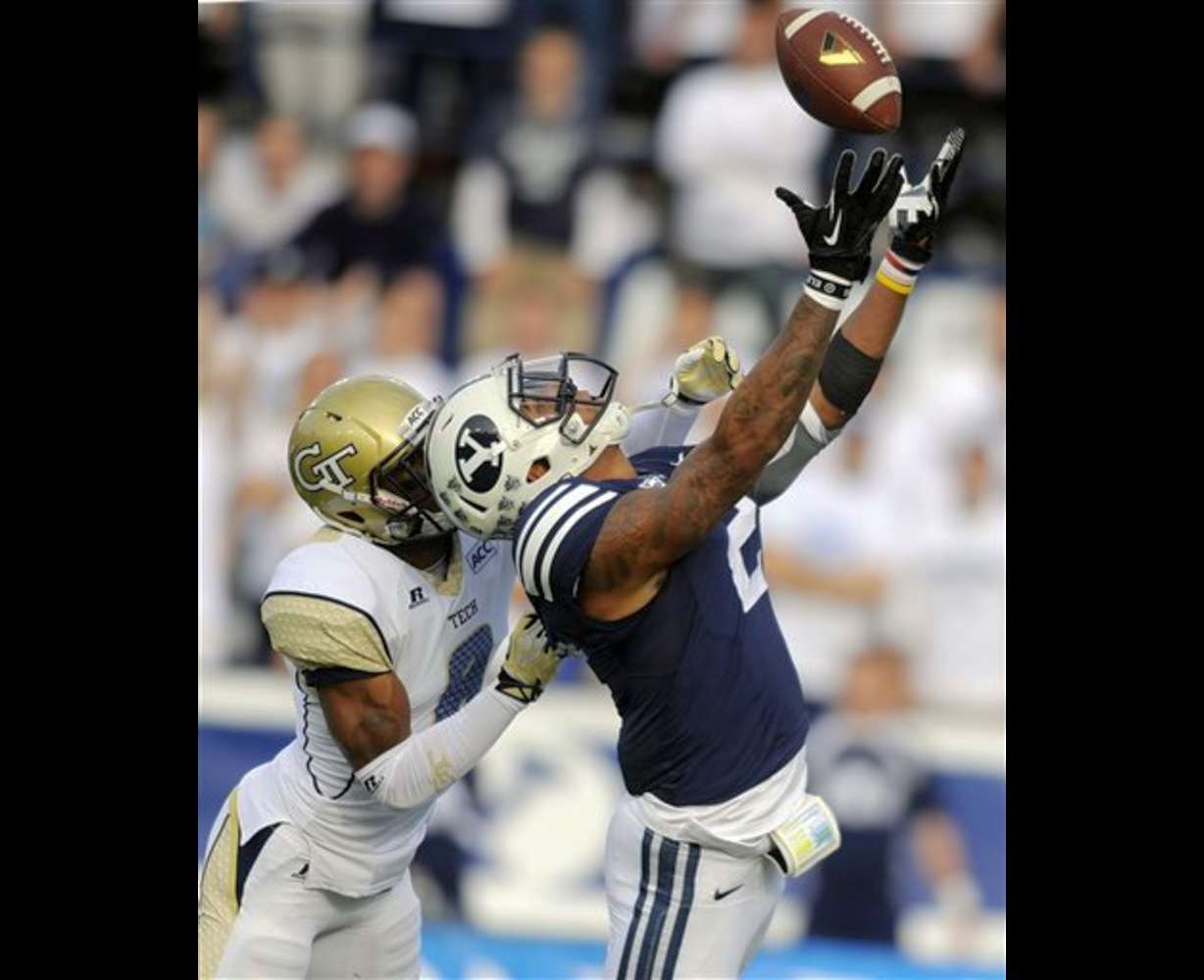 Brigham Young wide receiver Cody Hoffman (2) hauls in a touchdown reception in front of Georgia Tech cornerback Louis Young (8) during an NCCA college football game, Saturday, Oct. 12, 2013 in Provo, Utah. (AP Photo/The Deseret News, Matt Gade)