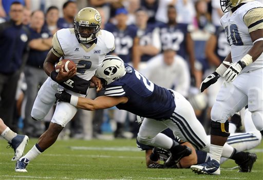 Georgia Tech quarterback Vad Lee (2) is tackled by Brigham Young defensive back Craig Bills (20) during an NCCA college football game, Saturday, Oct. 12, 2013 in Provo, Utah. (AP Photo/The Deseret News, Matt Gade)