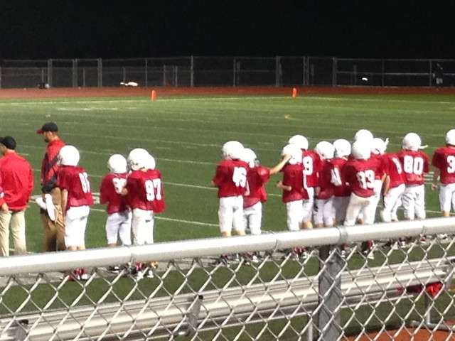 Susie Boyce's son, jersey number 80, stands on the sidelines. (Photo: Susie Boyce)