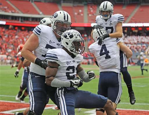 BYU's Jamaal Williams (21) celebrates his touchdown during the first
half of an NCAA college football game against Houston, Saturday, Oct.
19, 2013 in Houston. (AP Photo/Eric Christian Smith)