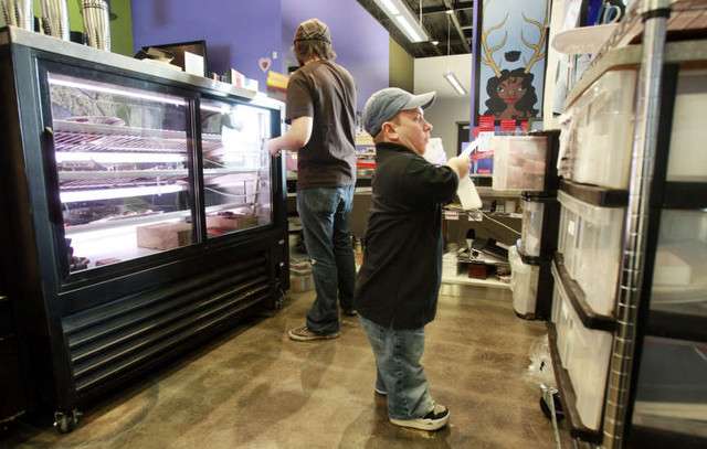 Steve assembles box parts for an order. Steve and his wife Katie Hatch
own and operate Hatch's Family Chocolates in Salt Lake City Monday,
Feb. 13, 2012. (Photo: Scott G Winterton, Deseret News)