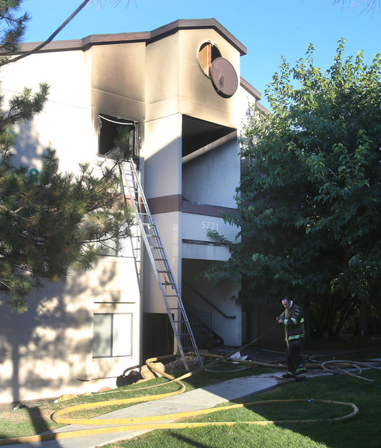 Apartment resident opens door to heat, fire