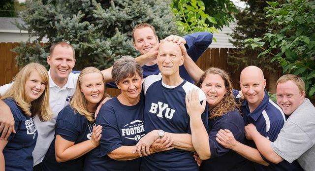 Just weeks before his recent passing, Glenn Perrins (4th from right) gathered with his family at their home in Moses Lake, Wash. This picture was taken on the night that BYU played Texas in Provo.