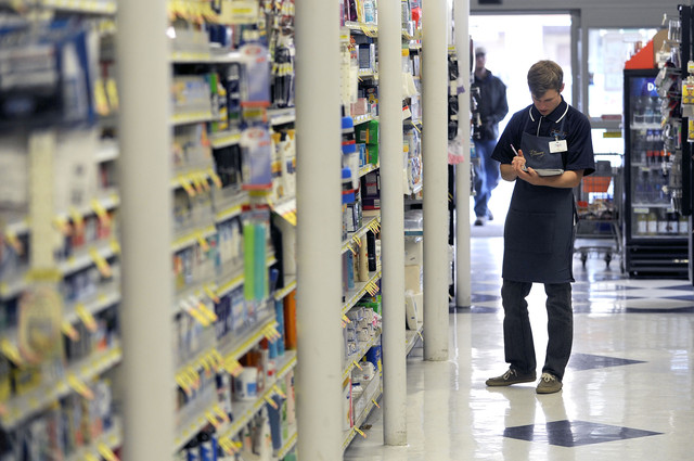 Caleb Larsen restocks shelves at the BYU Creamery on Ninth in Provo
on Wednesday, Oct. 30, 2013. The creamery is having a reopening
this week. (Photo: Matt Gade, Deseret News)