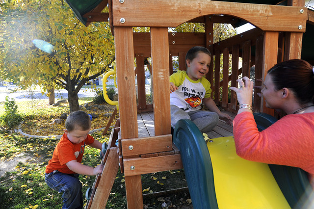 Four-year-old Carson Hancock, center, plays on 
the playground in the backyard of their Pleasant 
Grove home with his mother, Sara, and 3-year-old 
brother Blake on Friday, Nov. 1, 2013. Carson 
was diagnosed with Leukemia in May 2012 and, 
while he is still receiving treatments, the 
disease is in remission.