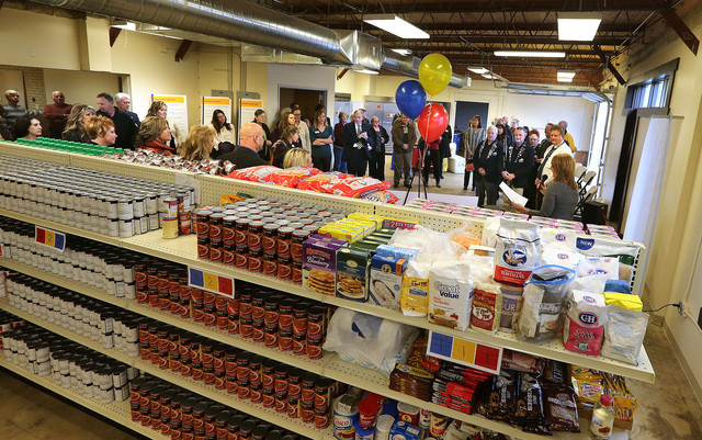 Crowds tour during the grand opening of the new client shopping area of the Joyce Hansen Hall Food Bank at Catholic Community Services, which is the largest food pantry in Utah, providing more than 2 million pounds of food each year to families and individuals in need, Monday, Nov. 4, 2013, in Ogden. (Photo: Tom Smart, Deseret News)