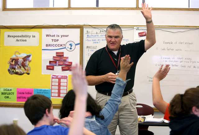 Jason Rogers teaches eighth-grade language arts at Midvale Middle
School in Midvale on Thursday, Nov. 7, 2013.
