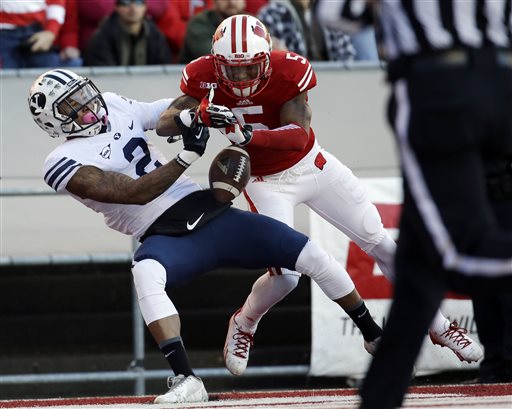 Wisconsin's Darius Hillary (5) breaks up a pass intended for Brigham
Young's Cody Hoffman during the first half of an NCAA college
football game on Saturday, Nov. 9, 2013, in Madison, Wis. (AP
Photo/Morry Gash)