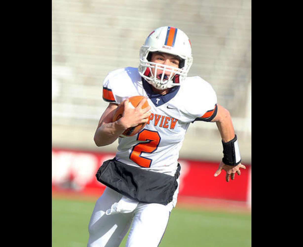 T-Bird quarterback Britain Covey runs with the ball against East High during the 4A Championship gem at Rice Eccles Stadium in Salt Lake City on Friday, Nov. 22, 2013. (Laura Seitz, Deseret News)
