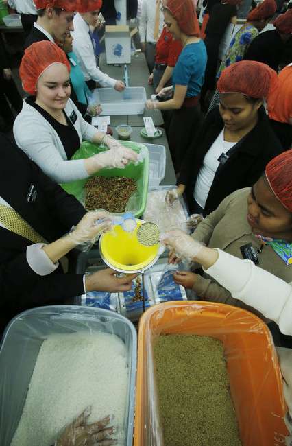 Thousands of LDS missionaries assemble 350,000 meals Thursday,
Nov. 28, 2013 in the Missionary Training Center in Provo Utah. (Photo:
Scott G Winterton, Deseret News)