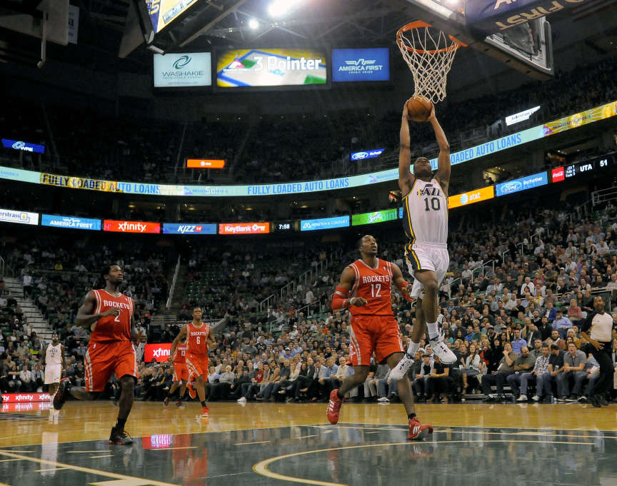 Utah Jazz point guard Alec Burks (10) gets the easy dunk in front of the Houston Rockets defense during a game at EnergySolutions Arena on Monday, December 2, 2013. (Matt Gade/Deseret News)