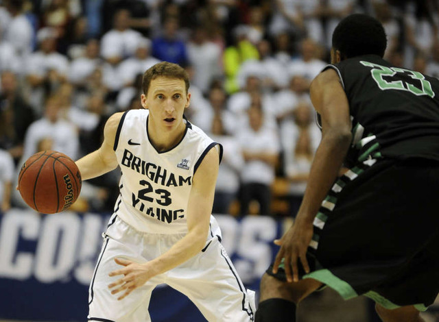 Brigham Young Cougars guard Skyler Halford (23) brings the ball down the court as North Texas Mean Green guard Jordan Williams (23) defends during a game at the Marriott Center in Provo on Tuesday, December 3, 2013.