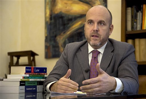 Lawyer Stefano Oliva talks during an interview
with The Associated Press, in Rome, Wednesday,
Dec. 4, 2013.
