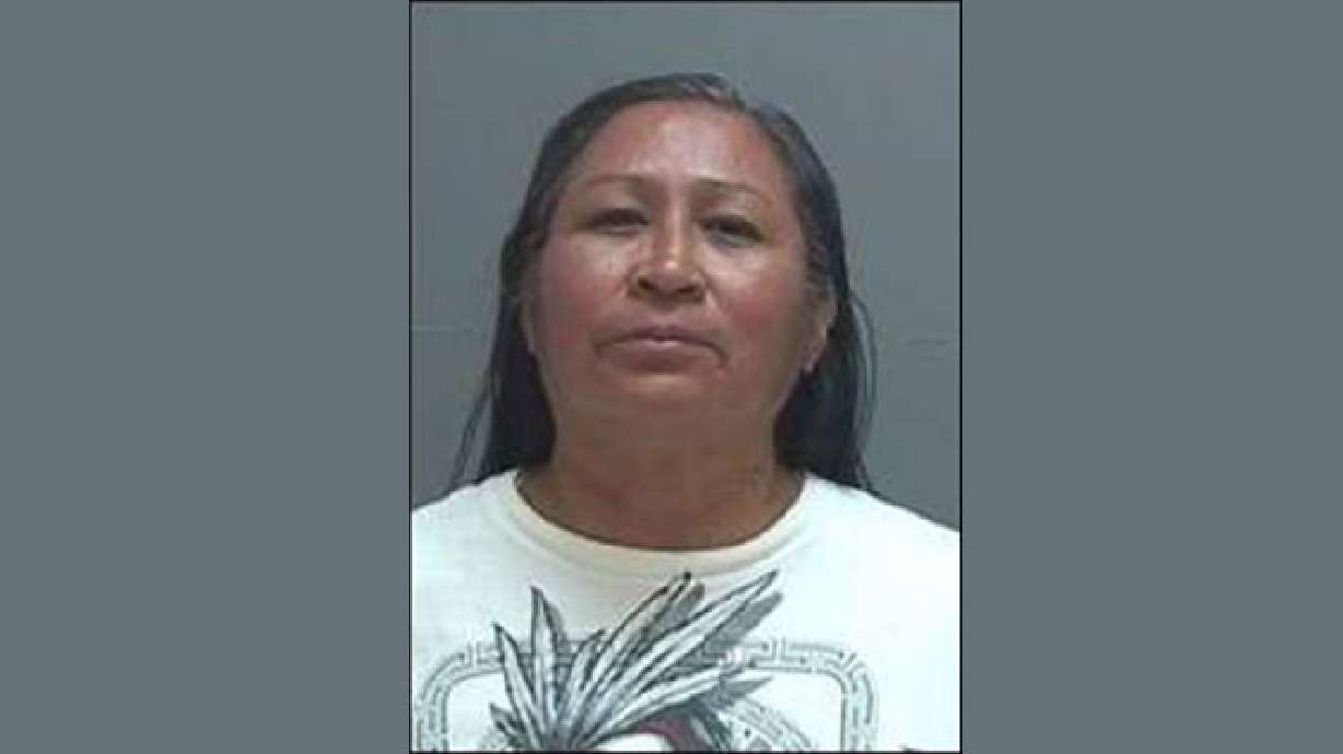 Woman arrested in connection with stabbing death