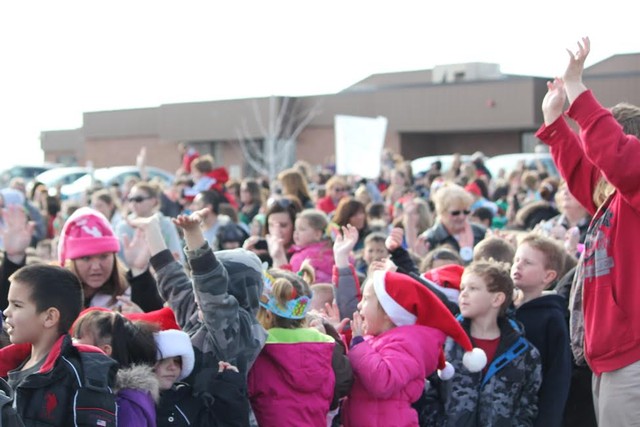 Students wait to greet Santa who arrived via
Chopper 5.