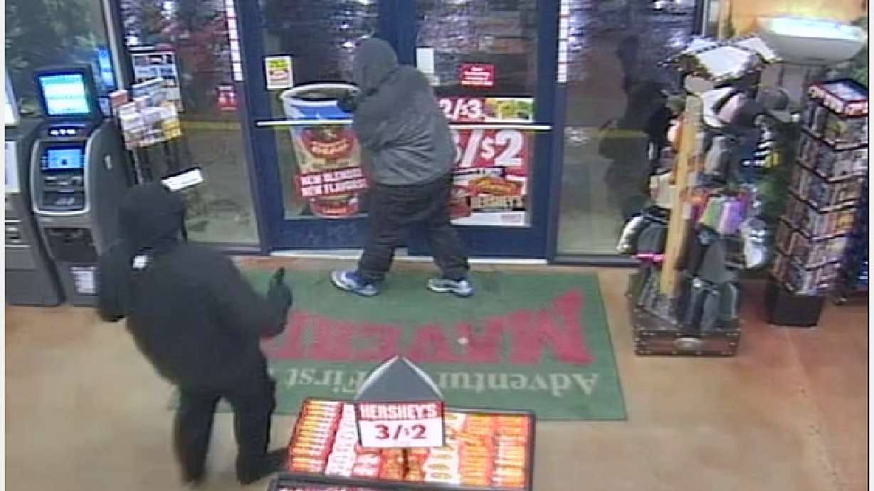 2 businesses robbed by same men, investigators say