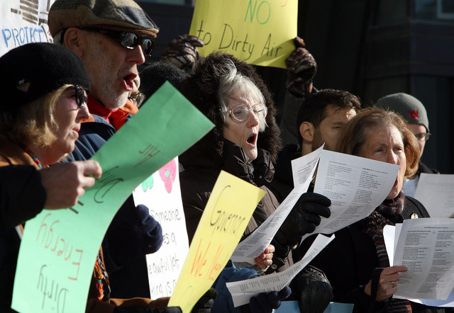 Clean air advocates sing renditions of carols to encourage change