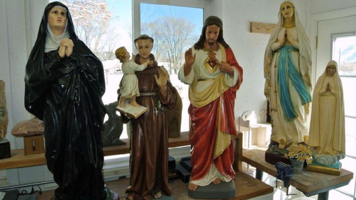 Smashed statues restored, returned to church