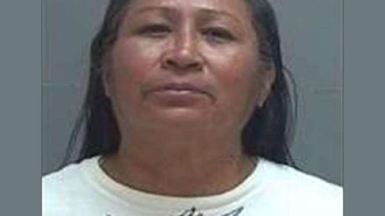 Woman charged in fatal stabbing near shelter