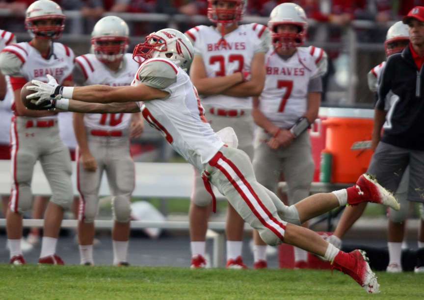 Bountiful's Tanner Redding catches a pass during a football game
against Lone Peak at Lone Peak High School in Highland on Friday,
Aug. 23, 2013.