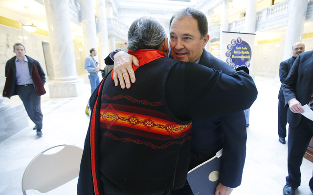 First Nation Representative Lacee Harris hugs Gov. Gary Herbert prior
to a blessing as the Salt Lake Interfaith Roundtable held a pipe
ceremony and sacred blessing for peace and understanding at the
state Capitol in Salt Lake City Wednesday, Feb. 12, 2014. (Photo:
Jeffrey D. Allred, Deseret News)