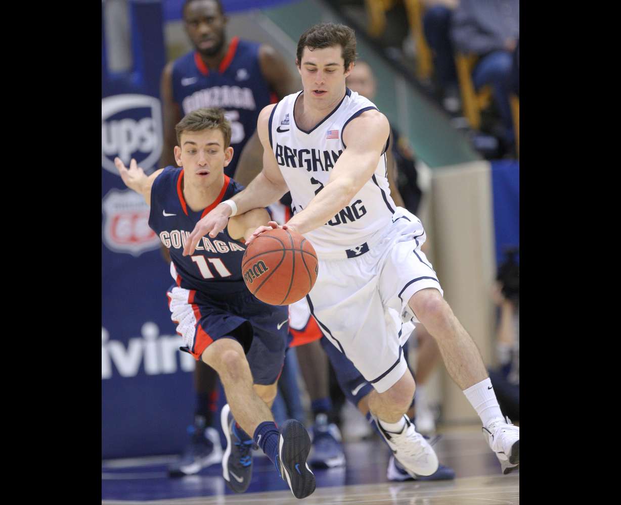 Brigham Young Cougars guard Matt Carlino (2) steals the ball from Gonzaga Bulldogs guard David Stockton (11) during NCAA basketball in Provo Thursday, Feb. 20, 2014. BYU won 73-65. (Jeffrey D. Allred, Deseret News)