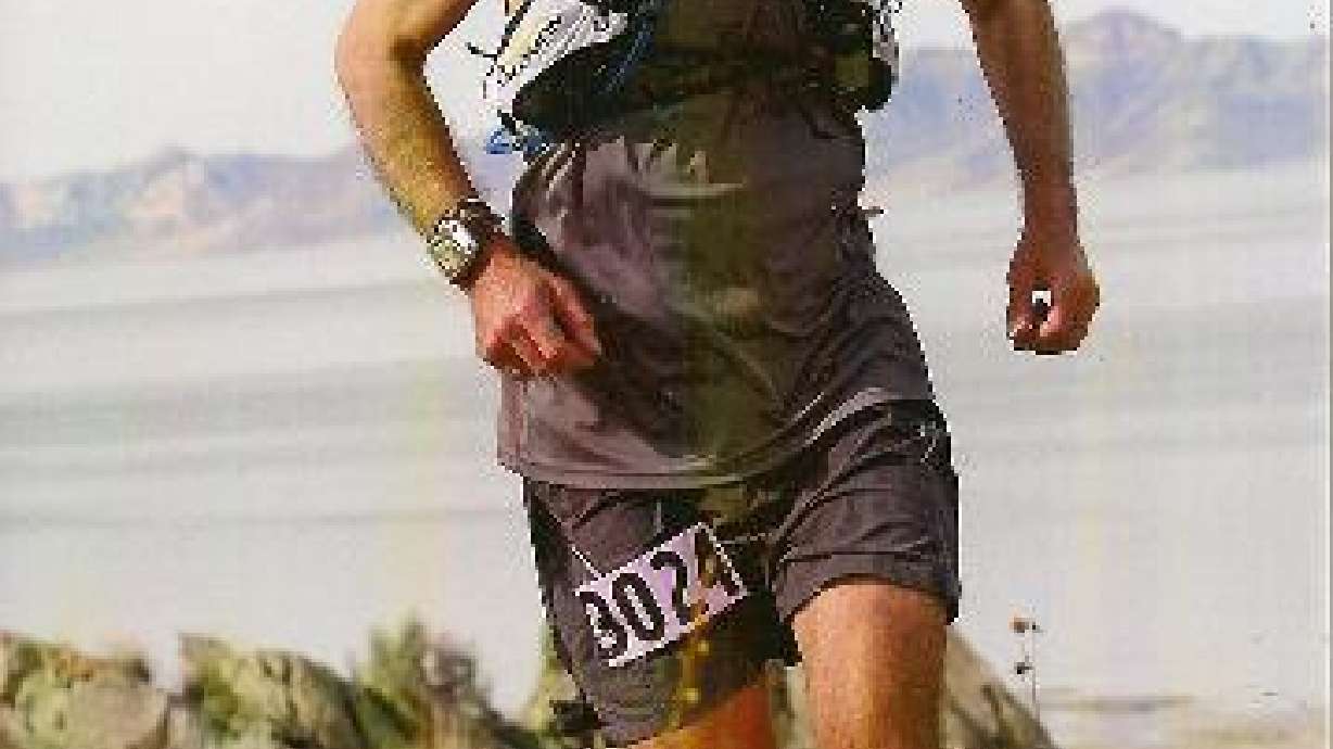 Man completes 100-mile race a year after beginning cancer treatments