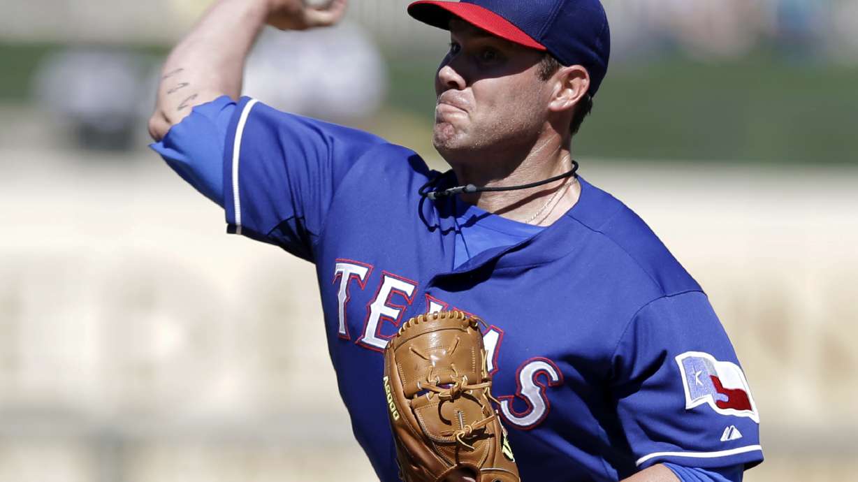 Texas' Colby Lewis struggles in return to mound