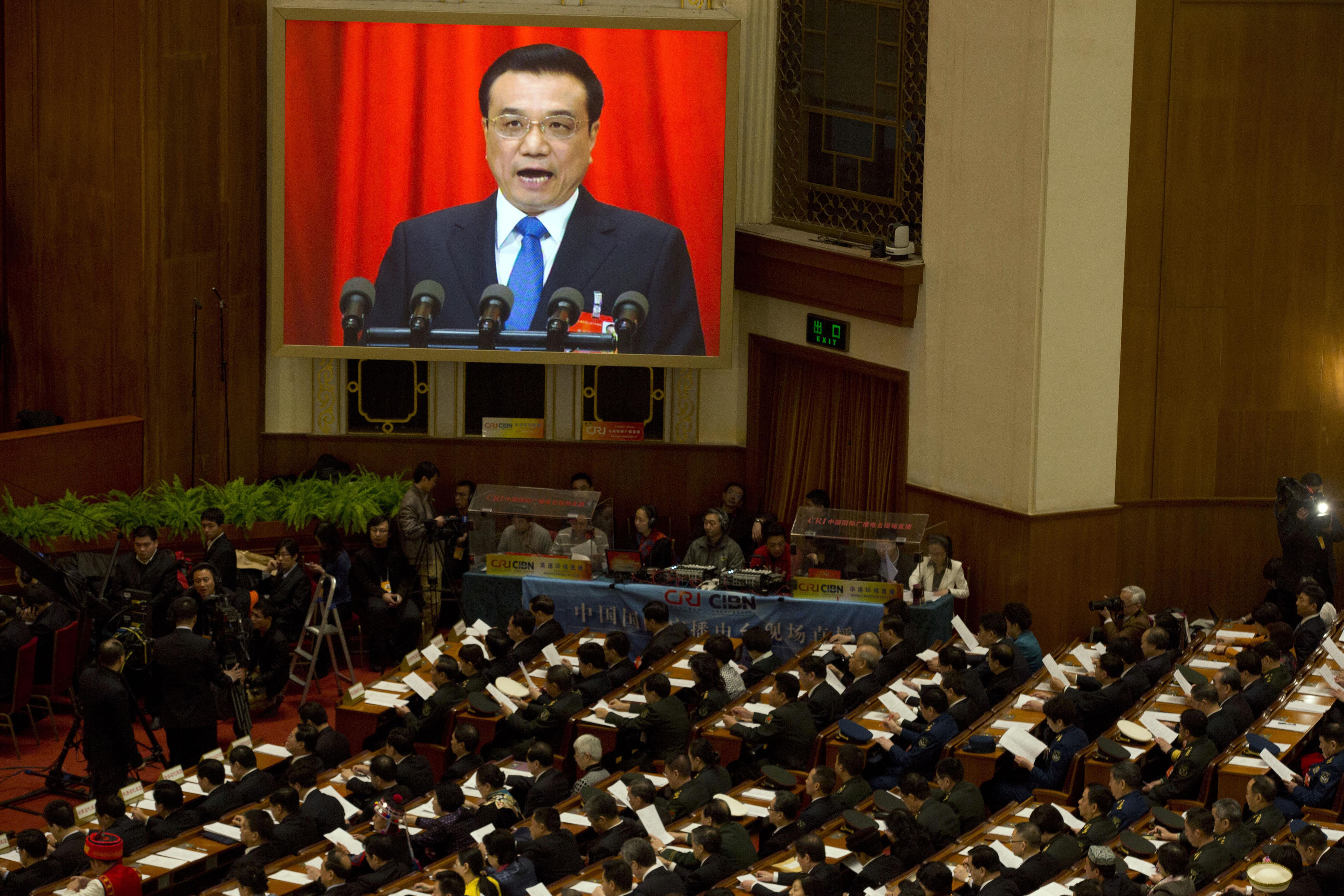 China premier promises to advance economy reforms