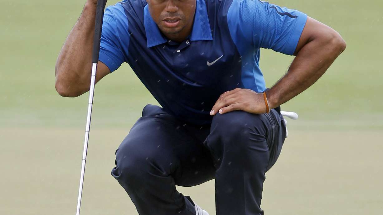 No birdies, but no back issues for Woods