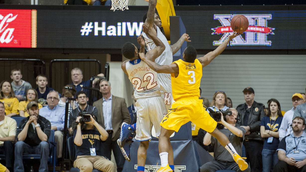 West Virginia beats No. 8 Kansas 92-86